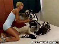 Zoosection - Blonde tattooed woman is having oral sex with her obedient pet